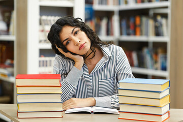 Tired student sitting in the campus library