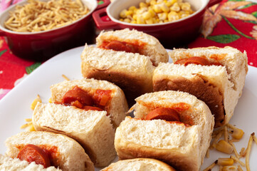 mini hot dogs with tomato sauce, potato sticks and corn