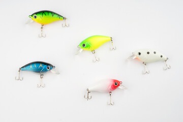 Creative arrangements of wobbler lures. Fishing lure with hooks. Plastic fish with hooks. Flat lay...