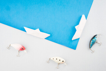 Creative arrangements of wobbler lures. Fishing lure with hooks. Plastic fish with hooks. Flat lay...