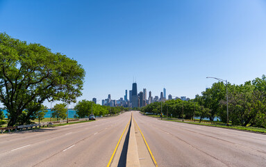 Chicago Downtown Skyline from Empty Lake Shore Drive Road on Sunny Cloudless Day