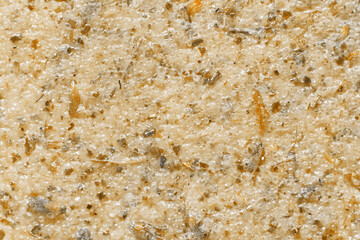 Brown sugar scrub texture background. Natural cosmetic exfoliation product closeup. Top view