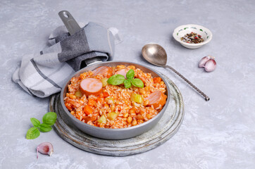 Stewed rice with beans, sausages and vegetables