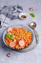 Stewed rice with beans, sausages and vegetables