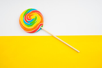 Candies and Sweets concept. Colorful lollipops on vibrant colored background