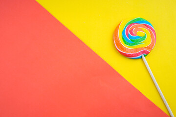 Candies and Sweets concept. Colorful lollipops on vibrant colored background