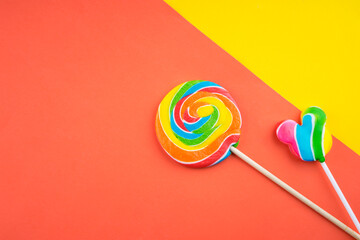 Candies and Sweets concept. Colorful lollipops on vibrant colored background