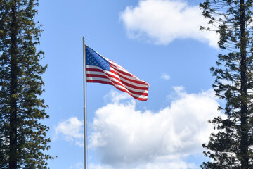 american flag against blue sky