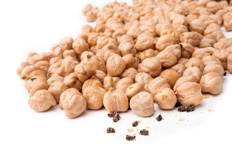 Multiple bean weevils or cowpea bettles on chickpeas. (Acanthoscelides obtectus) Lots of bug activity: dead and alive, and exit holes. Concept for pest control or infested food. Isolated on white.