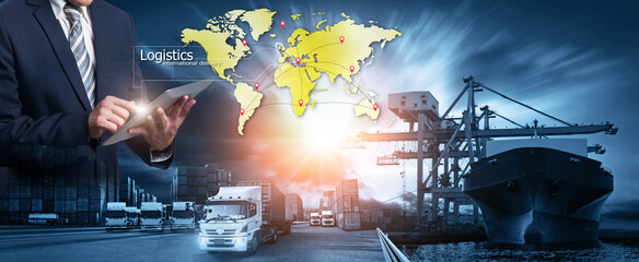 Business Logistics concept, Businessman manager touching icon of logistics for workers with Modern Trade warehouse logistics Global business connection technology interface global partner connection