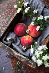 Wooden table and ripe peaches

