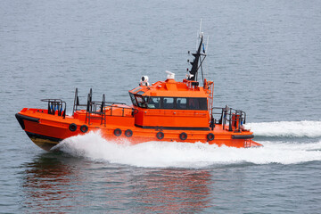 pilot boat in dark grey water