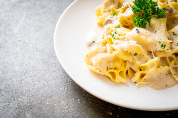 tortellini pasta with mushroom cream sauce and cheese
