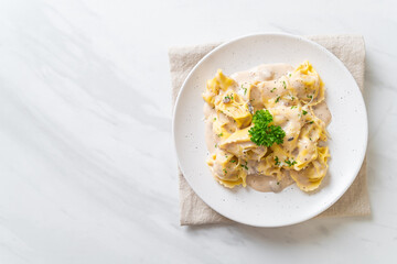 tortellini pasta with mushroom cream sauce and cheese
