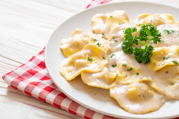 ravioli pasta with mushroom cream sauce and cheese