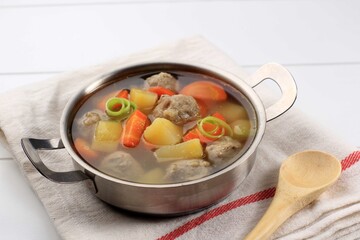 Homemade  Warm Vegetable Meatball Soup  with Carrot and Potato Served on Stainless  Bowl.