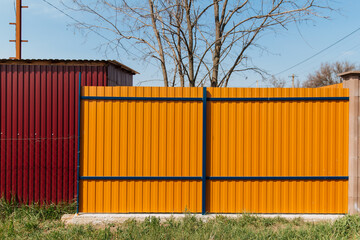 Tin fence with a beautiful textured pattern.