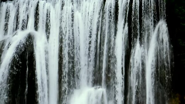 Big mountain river Pliva waterfall rich of water during spring time.