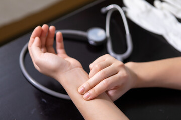 Doctor checking patient blood pressure and pulse close-up Image