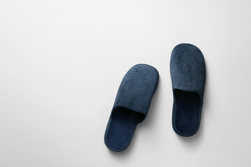 Pair of soft slippers on light background