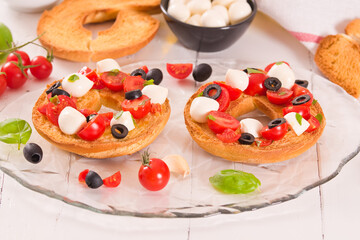 Friselle with tomatoes and mozzarella cheese.
