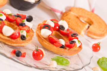 Friselle with tomatoes and mozzarella cheese.
