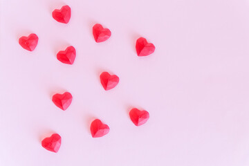pink Background for design to Valentine's Day. Decorative red hearts. View from above. Valentines Day concept.lovely heart frame for your design. postcard.The mood of tenderness and love