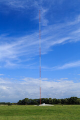 An AM radio transmitter tower soaring high into the sky