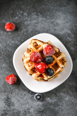 Belgian or french waffles for breakfast. Beautiful serve waffer cake with berries