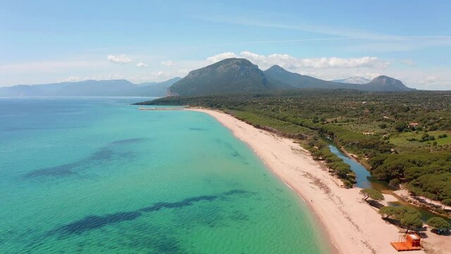 4k point of view video (Ultra High Definition). Aerial morning view of Osala Beach. Bright summer scene of Sardinia island, Italy, Europe. Picturesque seascape of Mediterranean sea.