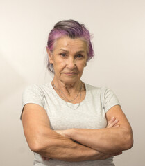 Close-Up Portrait Of Serious elderly woman With Folded Hands or crossed arms - 356578088