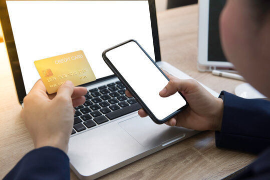 woman hands holding a smartphone and mock up credit card.