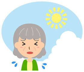 炎天下の暑さに苦しむ高齢の女性