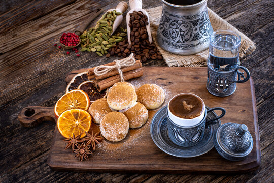 Coffee in a traditional mug and coffee beans on the wooden table © studio GDB