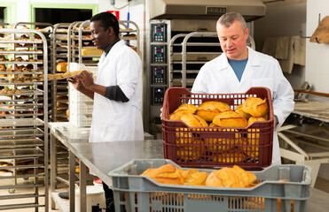 Baker sorts finished products at the bakery