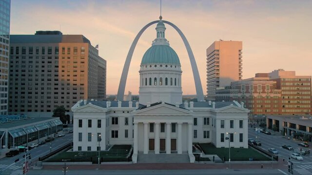 Aerial: St Louis Old Courthouse & The Gateway Arch at sunset, Missouri, USA