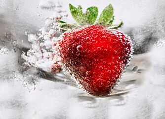 Strawberry in water with bubble.