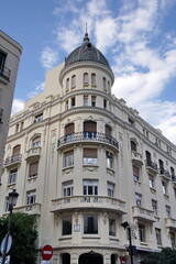 Fototapeta na wymiar Mediterranean architecture in Spain. Old apartment buildings in Madrid - Calle Mayor.