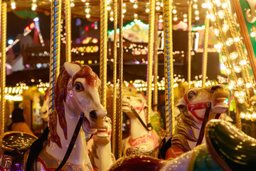 Fototapeta na wymiar Merry-go-round in a Christmas fair, Winter Wonderland in London