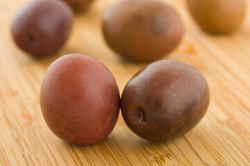 black  olives on a bamboo board