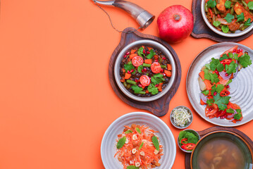 Lenten menu dishes assortment. Different healthy vegetable salads. Bright orange background. Flat...