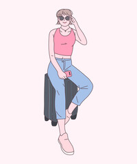 캐리어를 잡고 서있는 사람