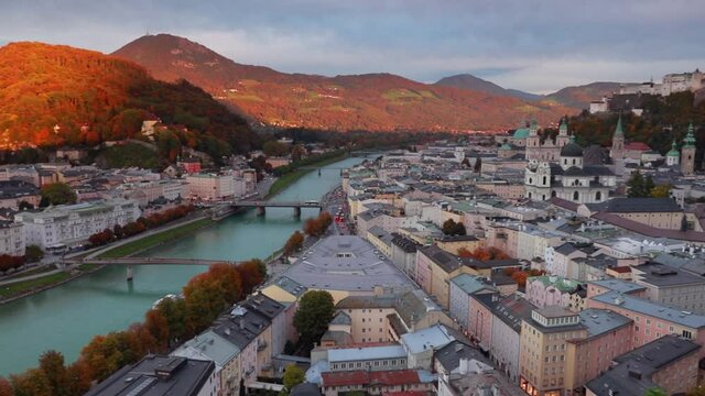 Colorful evening cityscape of Salzburg, Old City, birthplace of famed composer Mozart, Eastern Alps. Autumn scene of Salzach river. Traveling concept background. Full HD video (High Definition).
