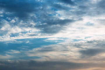 Fototapeta premium Beautiful blue sky with clouds. Sky clouds background. Fluffy white cloud formation in a beautiful blue sky. Sky before the rain. Bird's-eye view. Nice wallpaper. Summer day.