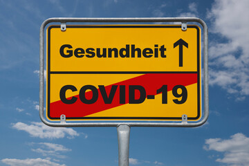 Fototapeta premium Ortstafel Deutschland, Ende der geschlossenen Ortschaft mit der Beschriftung Ende COVID-19, Anfang Gesundheit
