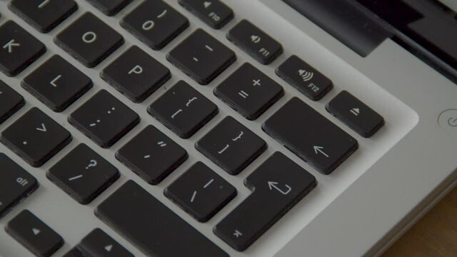 Finger pressing the backspace button on keyboard several times