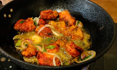 frying pan with fried chicken