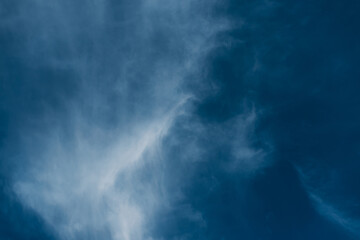 Obraz premium Beautiful blue sky with clouds. Sky clouds background. Fluffy white cloud formation in a beautiful blue sky. Bird's-eye view. Nice wallpaper. Summer day.