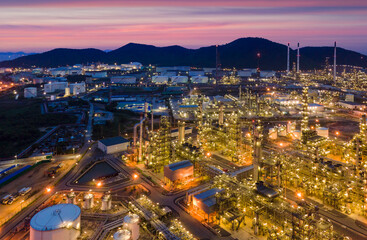 Fototapeta na wymiar Oil refinery plant from industry zone, Aerial view oil and gas petrochemical industrial, Refinery factory oil storage tank and pipeline steel at twilight.