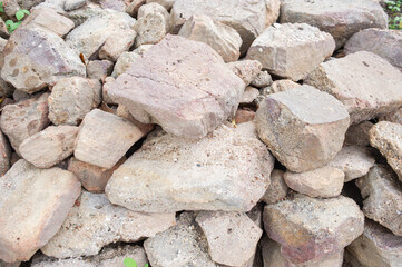 Many stones are stacked together in a pile.